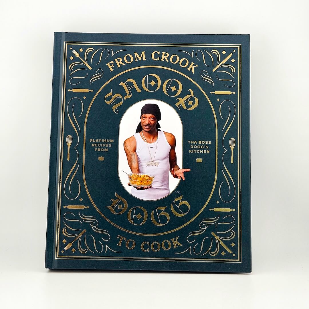 Cover of Snoop Dogg's cookbook against white background. 