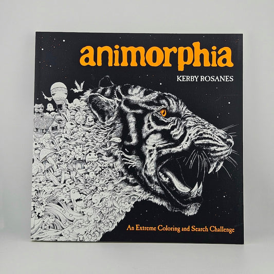 Cover of coloring book with tiger face and orange title. 