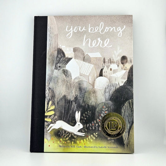 Hardcover book with artistic landscape illustration as cover