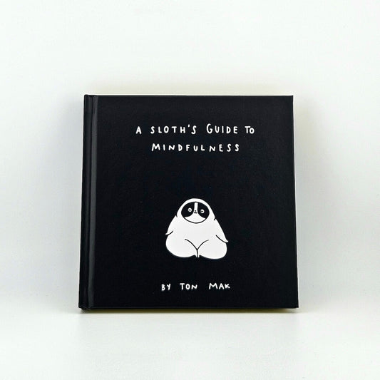 Black book with white text and sloth illustration against white background. 