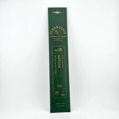 Dark green rectangular package of incense with brown text describing product. 