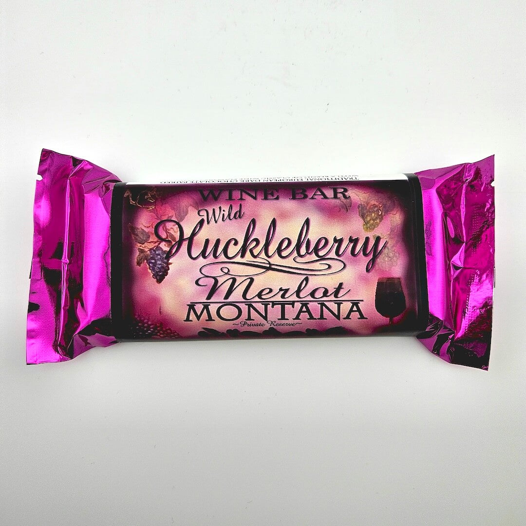 Wine bar packaging with pink foil wrapping on a white background