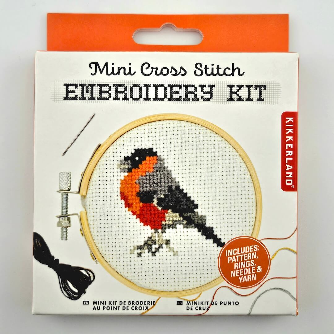 Kikkerland Mini Cross Stitch Embroidery Kit packaging with a bird design on a white background