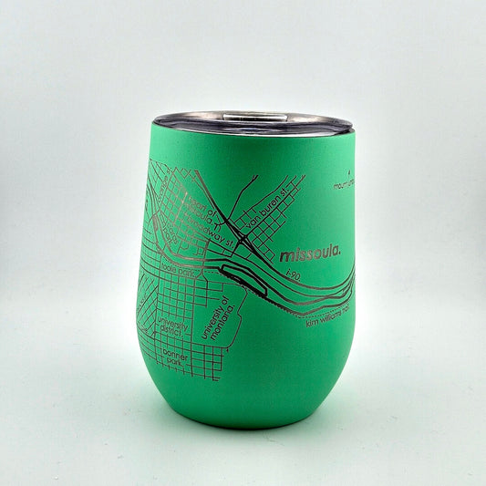 Green insulated tumbler with map design and 'Missoula' text on a white background