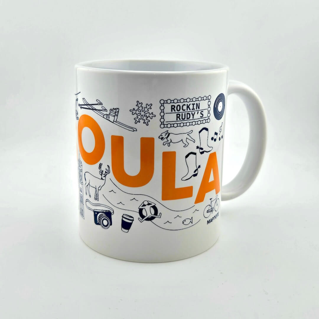 White mug with colorful graphics and text on a white background