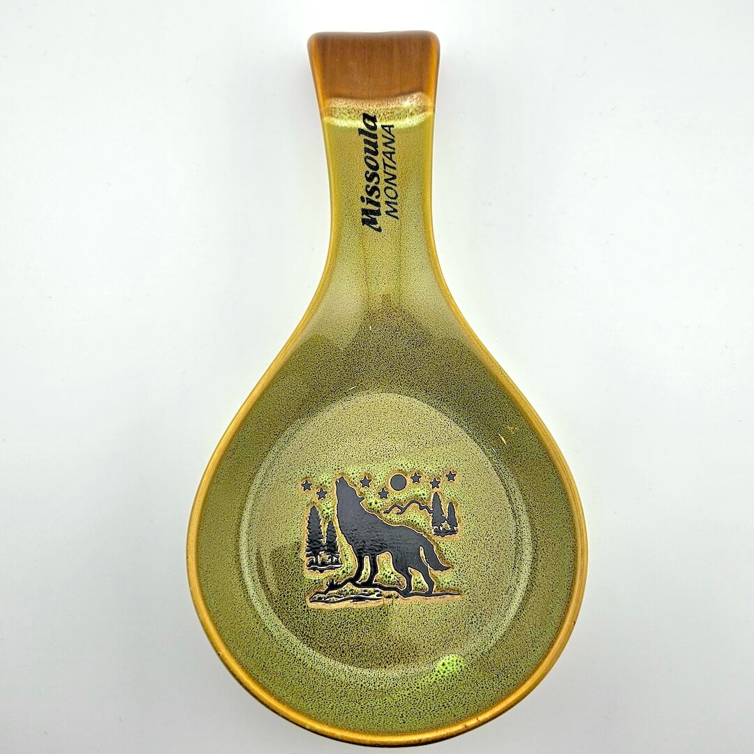 Spoon rest with wolf design and 'Missoula Montana' text on a white background