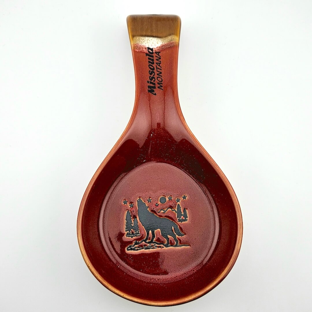 Ceramic spoon rest with engraved design and 'Missoula Montana' text on a white background