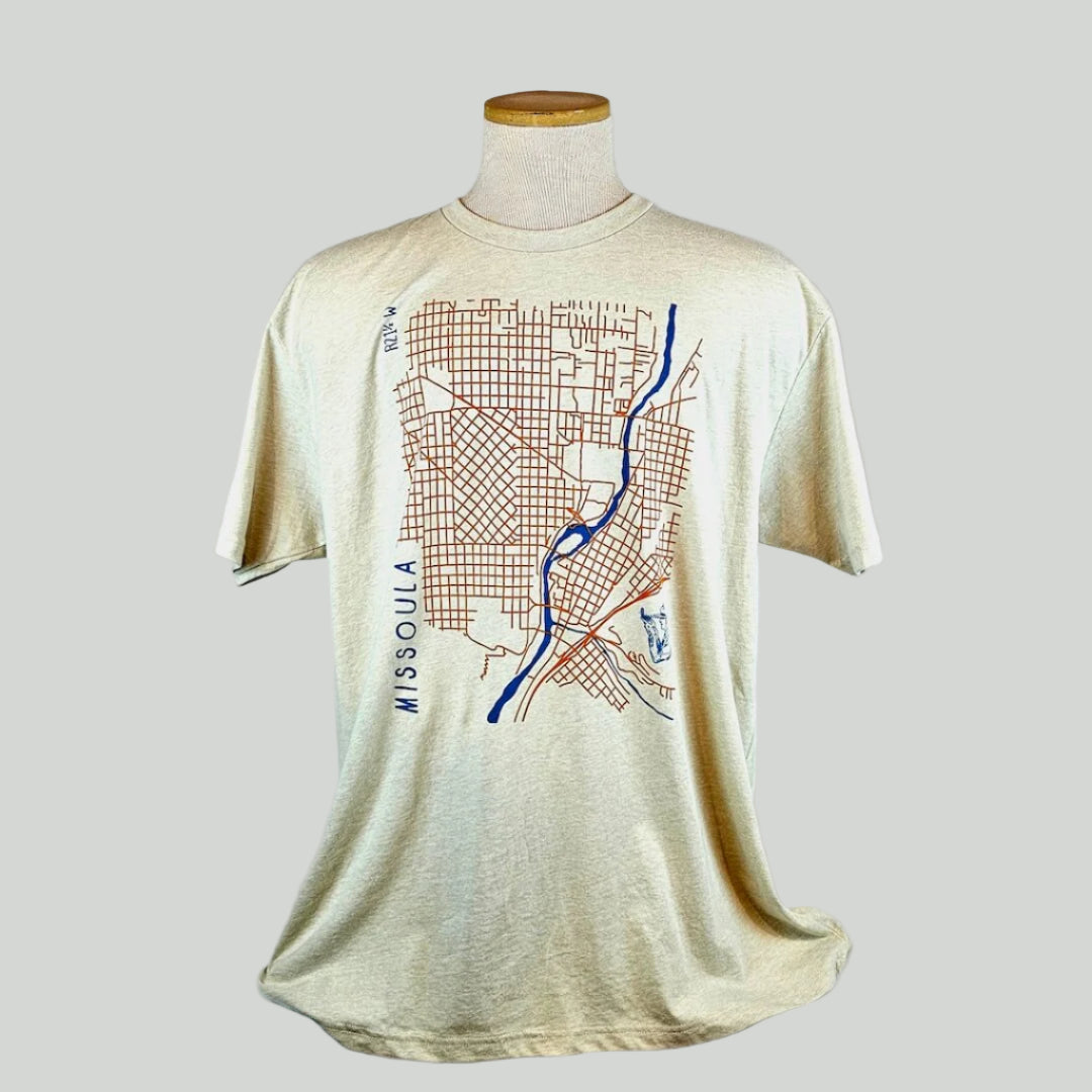 Beige t-shirt with a map design on a mannequin against a white background