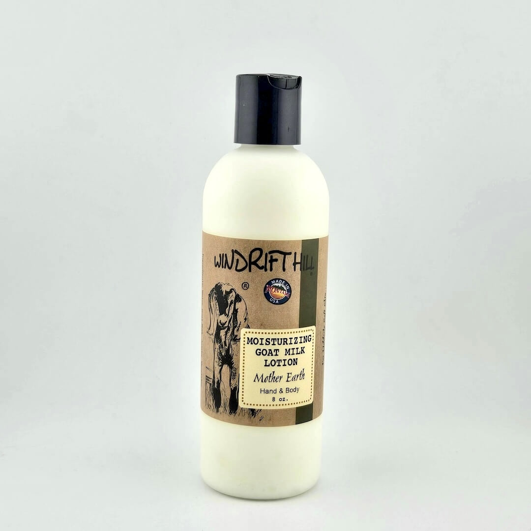 Plastic bottle of Windrift Hill moisturizing goat milk lotion on a gray background