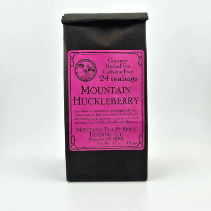 Black paper bag with rolled top with hot pink/fuchsia label describing flavor and ingredients. 