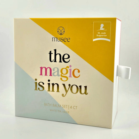 Bath balm set packaging with 'musee' branding and text 'the magic is in you' on a white background.