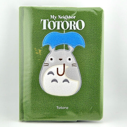 Green plush notebook with Totoro design and 'My Neighbor Totoro' text on a white background
