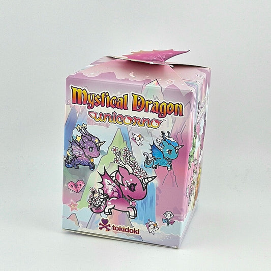 Brightly colored box with unicorn imagery against gray background. 
