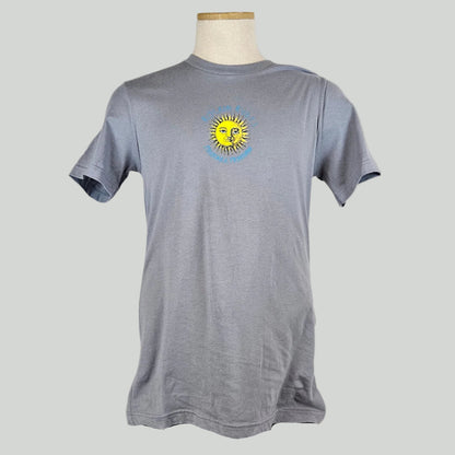 Gray t-shirt with small sun in center with "ROCKIN RUDY'S" & "MISSOULA, MONTANA" encircling it. 
