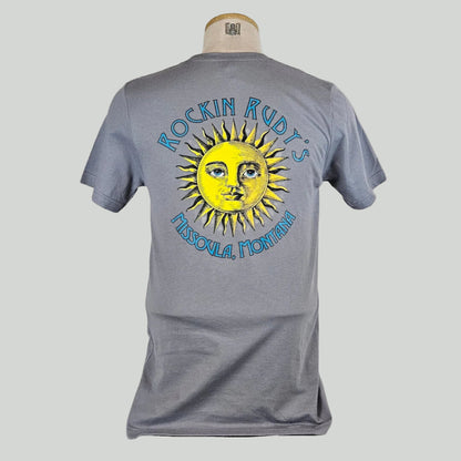 Gray t-shirt with large sun in center with "ROCKIN RUDY'S" & "MISSOULA, MONTANA" encircling it. 