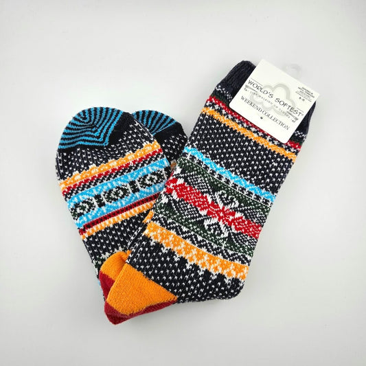 Pair of colorfully patterned socks against light gray background.