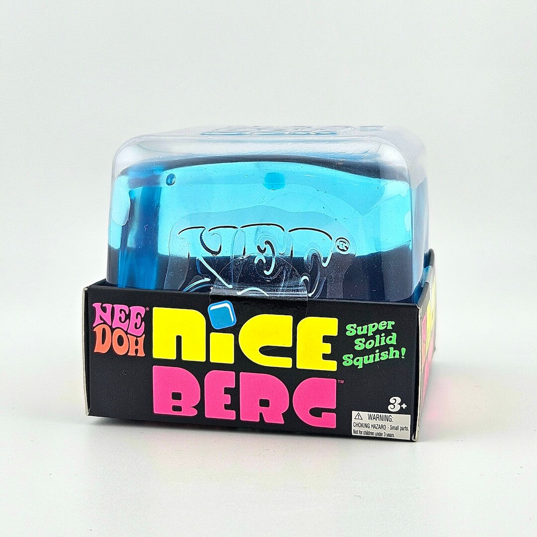 Blue toy in a transparent box with colorful packaging on a white background