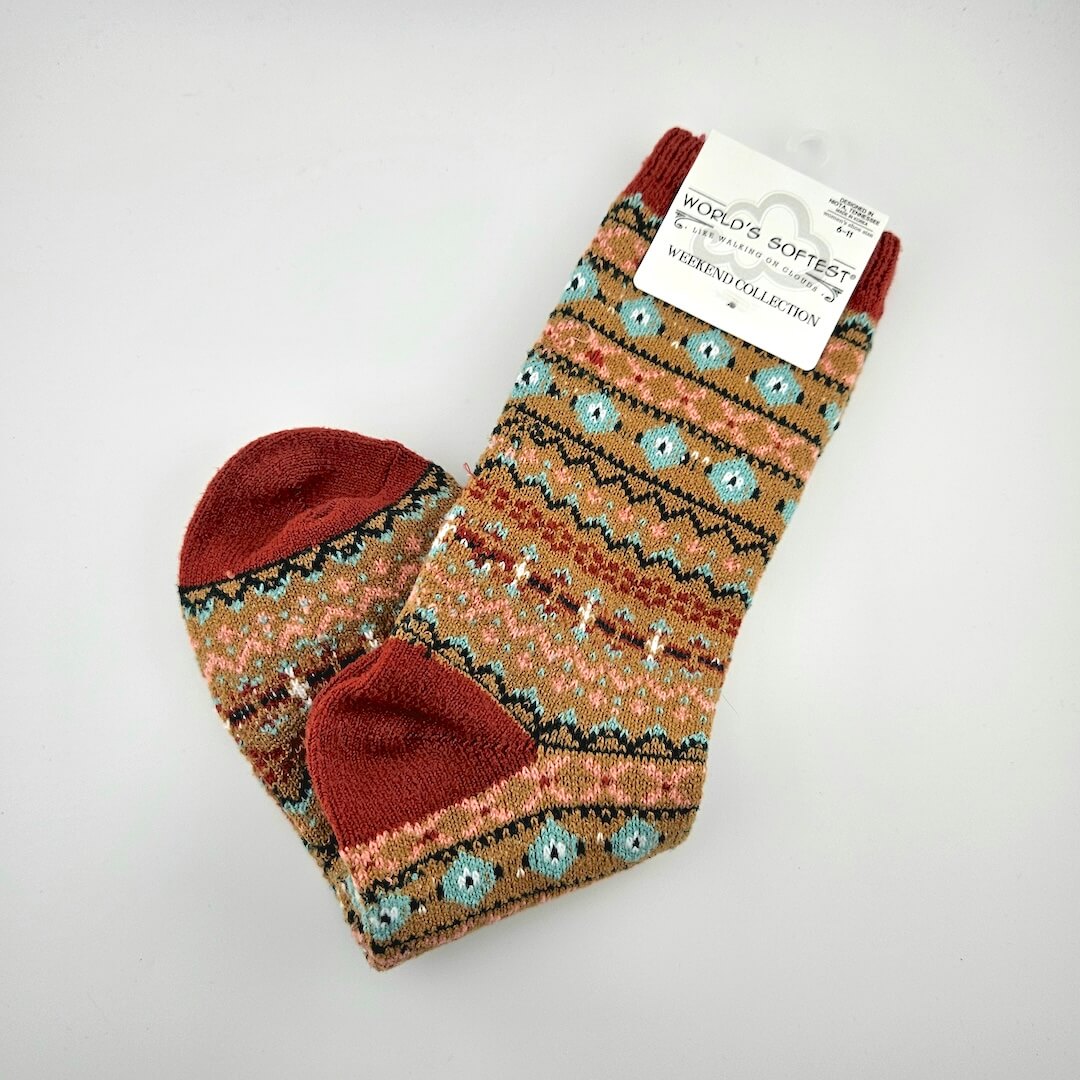 Pair of patterned socks with a visible brand tag on a white background
