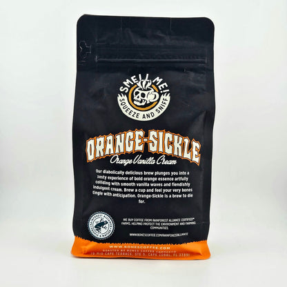 Black coffee bag with 'Orange Sickle' branding on a white background