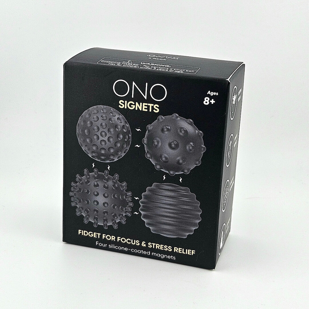 Black box packaging of ONO Signets fidget toys on a light gray background