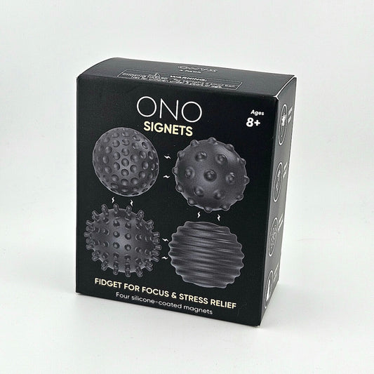 Black box packaging of ONO Signets fidget toys on a light gray background