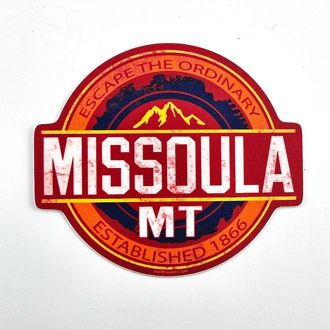 Round sticker with 'Missoula MT' text and mountain design on a white background