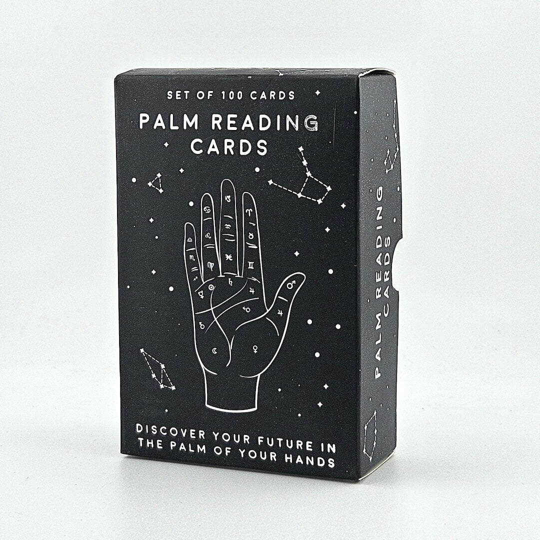 Box of palm reading cards with astrological symbols on a white background