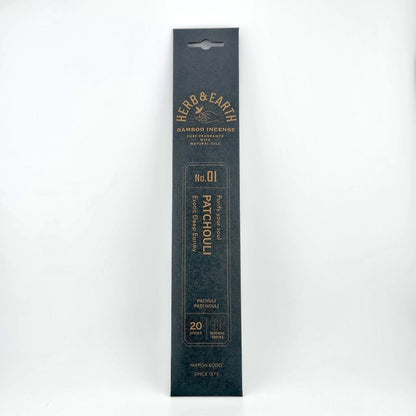 Black rectangular package of incense with brown text describing product. 