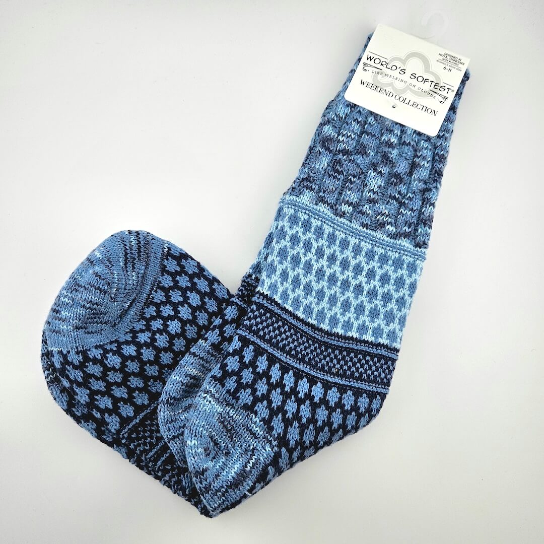 Pair of brightly colored socks with visible brand label against light gray background.