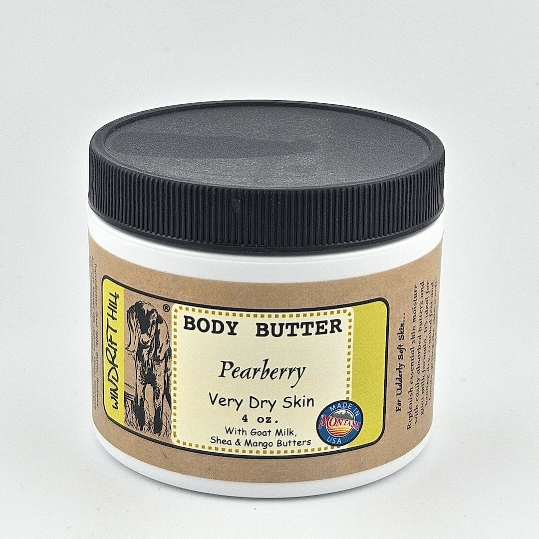 Jar of body butter with a label on a gray background