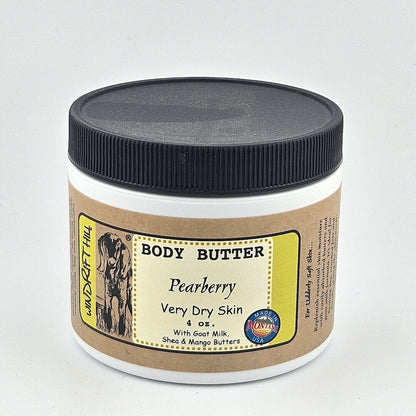 Jar of body butter with a label on a gray background