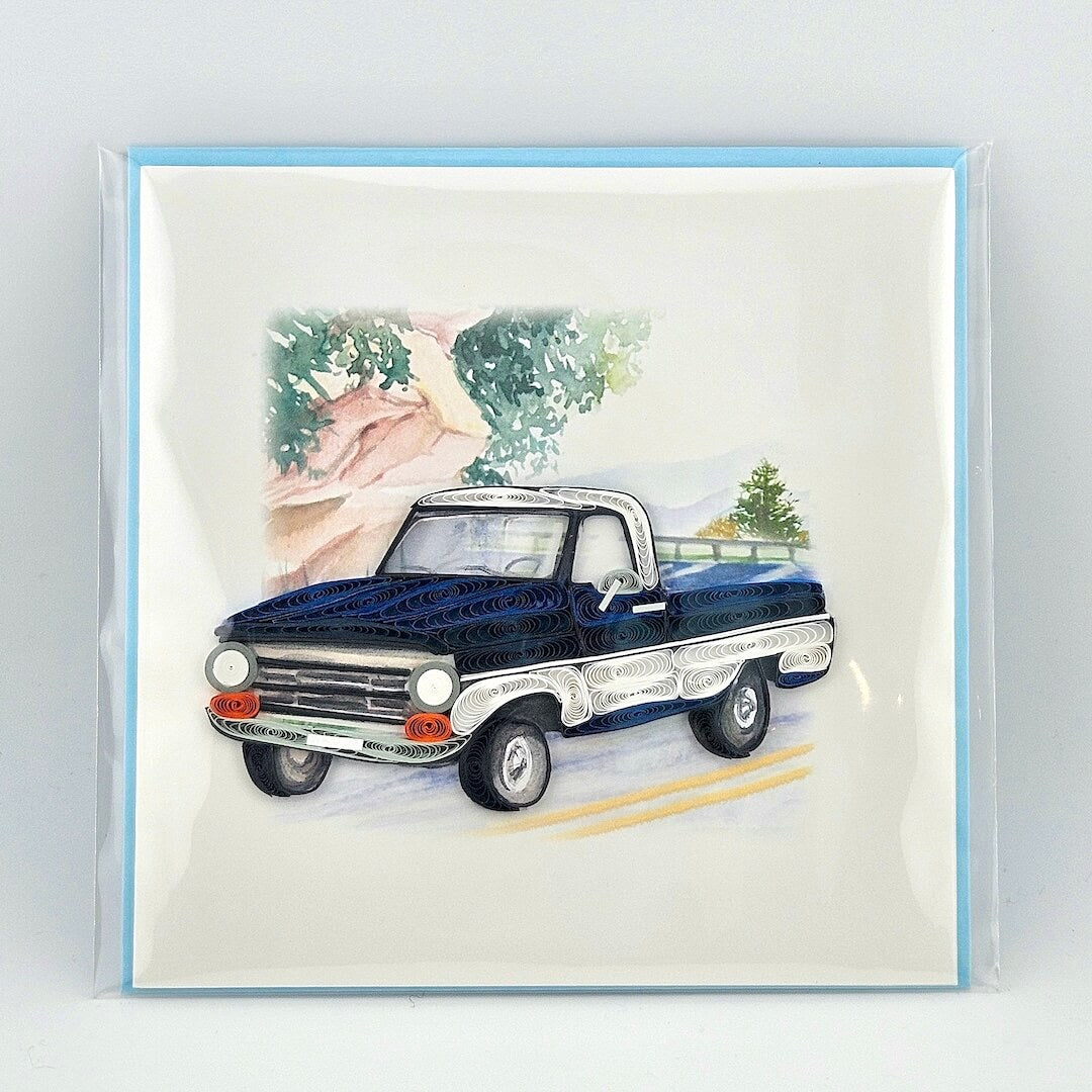 Vintage blue truck illustration on a greeting card with a light blue border.