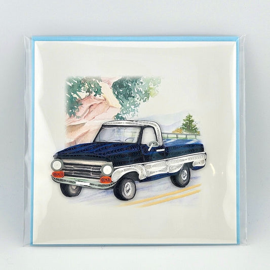 Vintage blue truck illustration on a greeting card with a light blue border.