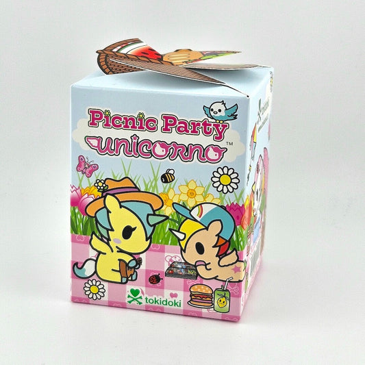 Brightly colored box with unicorn imagery against gray background. 