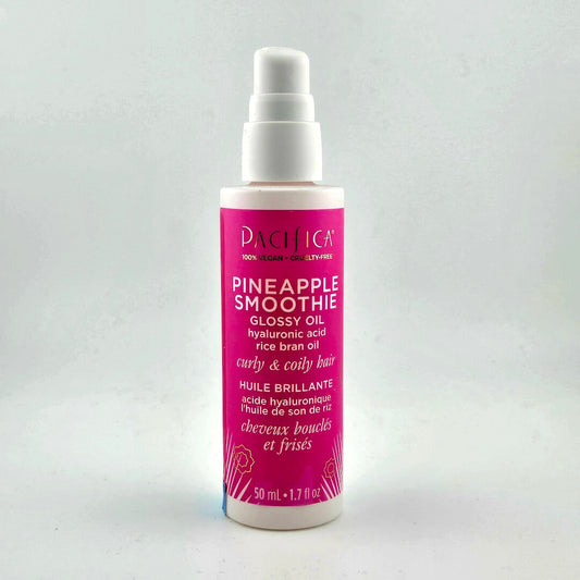 Pink bottle with white top and text against white background.