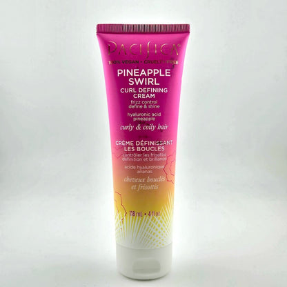 Squeeze bottle with pink and orange ombre and white text against white background.