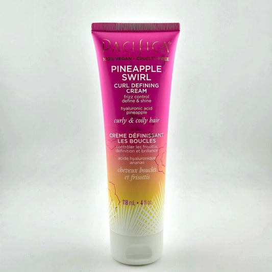 Squeeze bottle with pink and orange ombre and white text against white background.