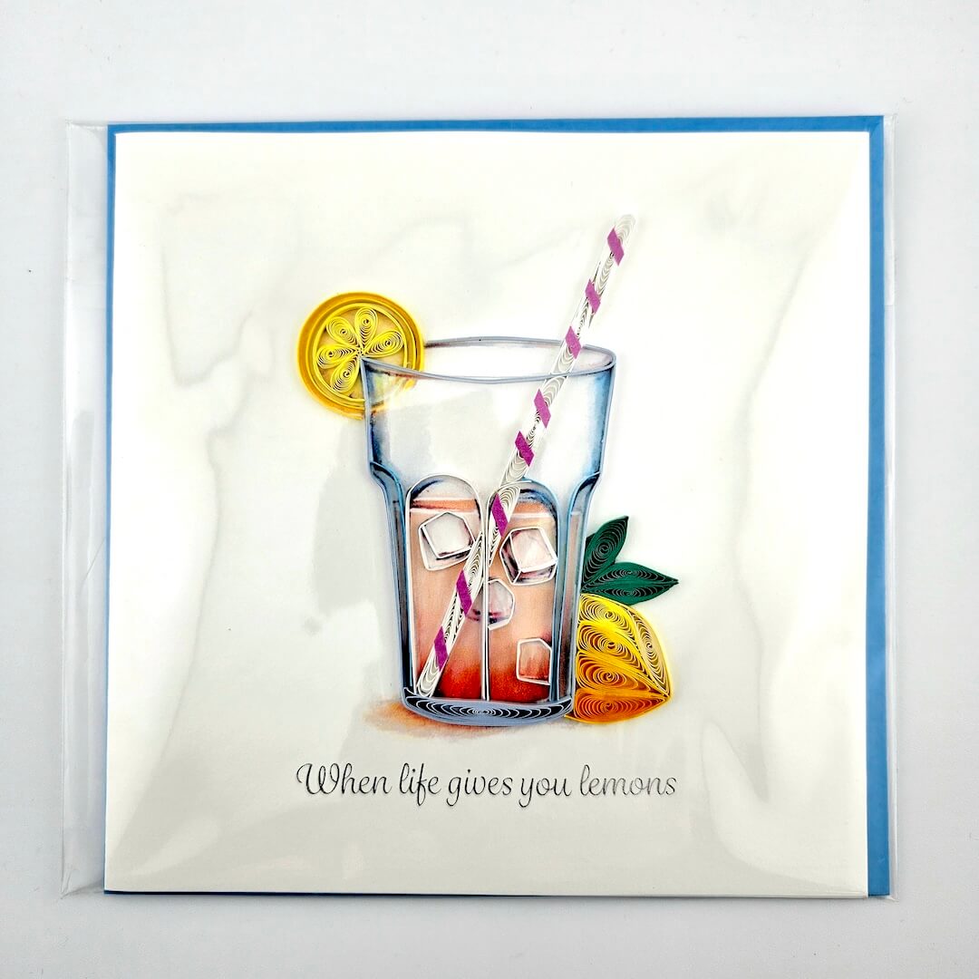 Card with a glass of lemonade and lemons on a white background