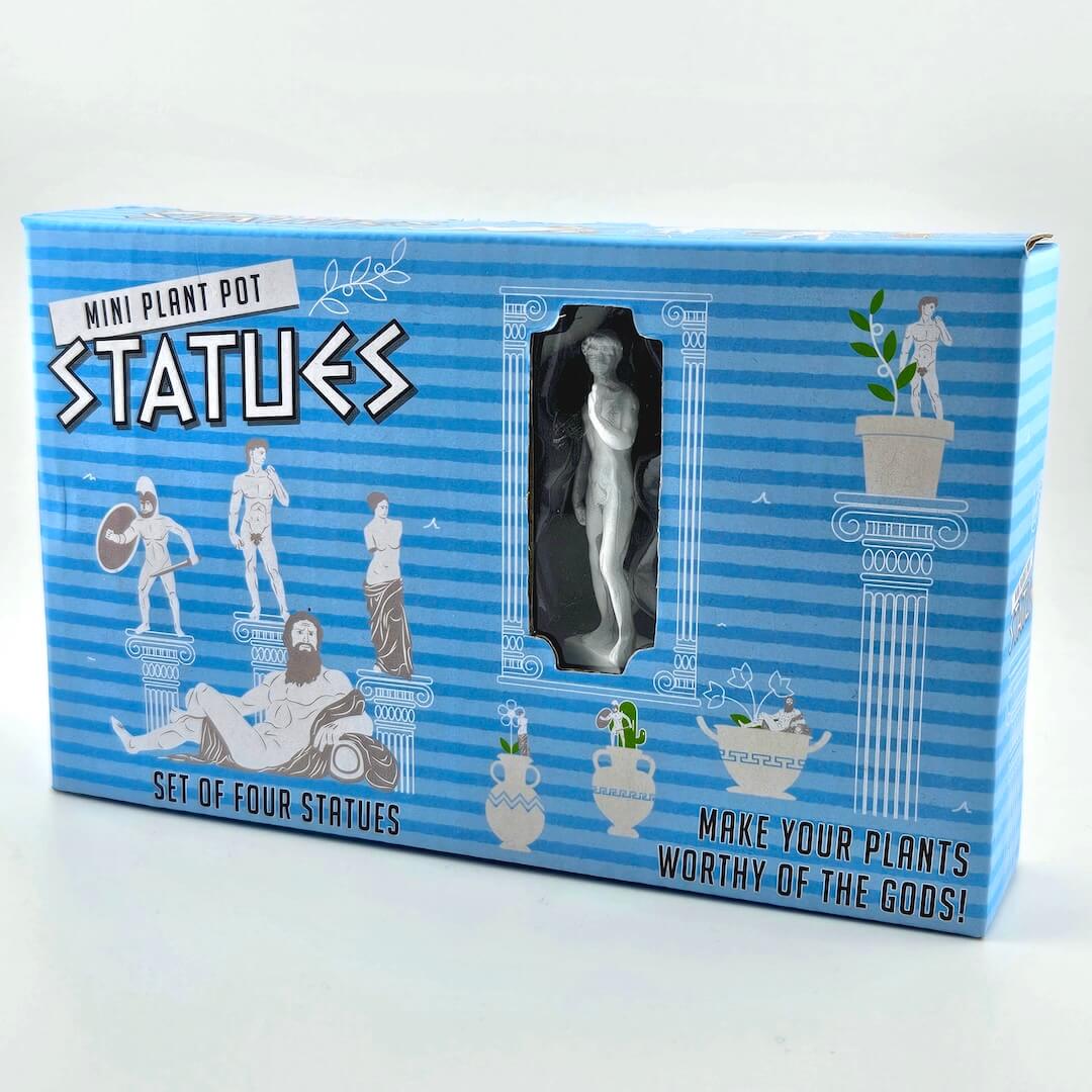 Box of mini plant pot statues with blue and white striped design