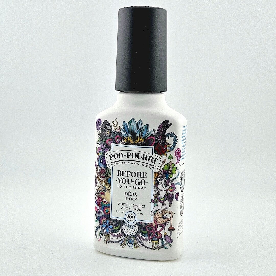 Black capped white spray bottle with floral design for air freshener against white background. 