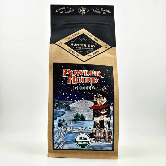 Coffee bag with a dog illustration and 'Powder Hound Coffee' branding on a white background