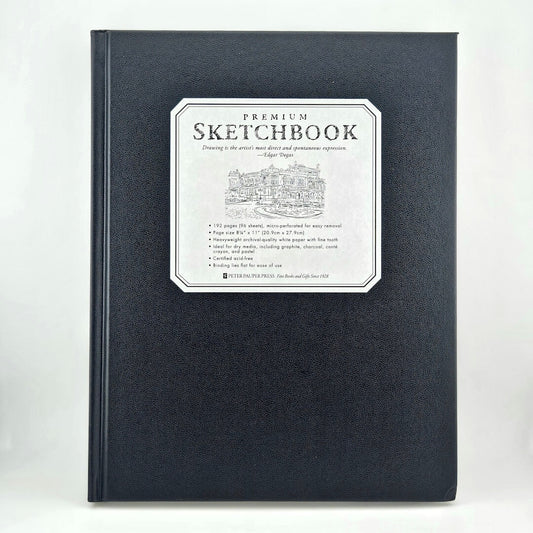 Black sketchbook with a white label on a white background