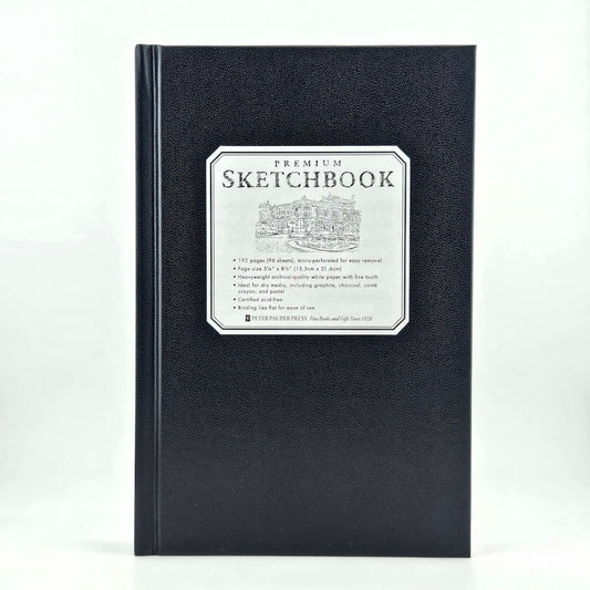 Black sketchbook with a label on a white background