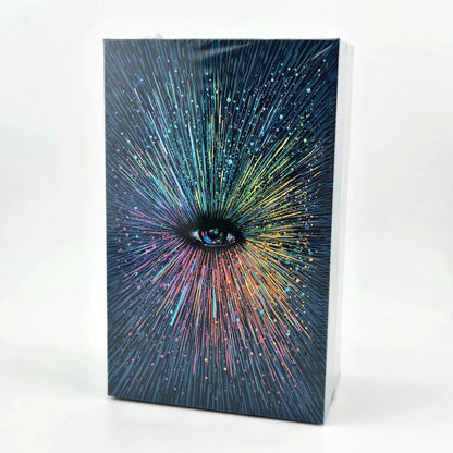 Tarot deck with eye in center with colorful rays emanating from it. 