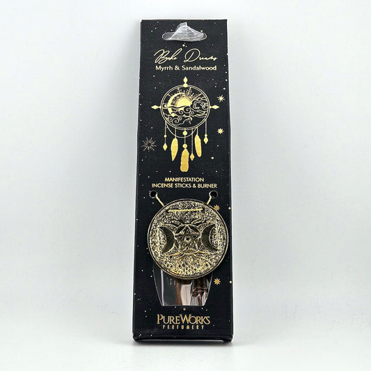 Packaged incense sticks and burner with star and moon design on a white background