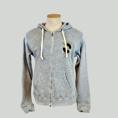Gray zip-up hoodie with a logo on a mannequin against a gray background