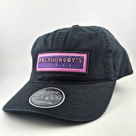 Black cap with a pink and purple logo on a white background