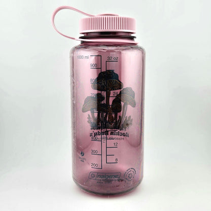 Light pink water bottle with matching lid. Green mushrooms as center image with stars on tops, store name & location below. 