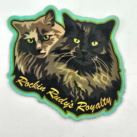 Sticker with two cats and 'Rockin Rudie's Royalty' text on a white background