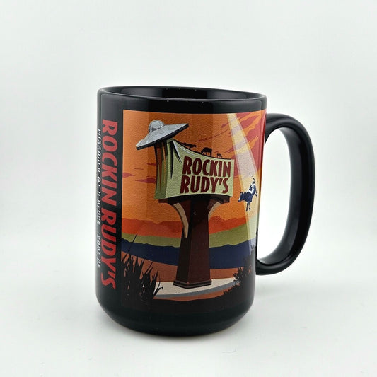 Black mug with 'Rockin Rudy's' graphic design on a white background